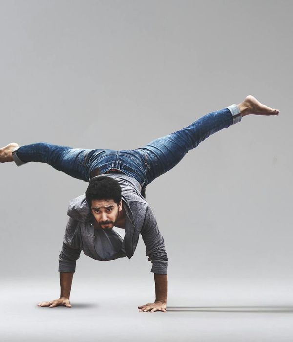 Man performing a controlled strength exercise with focused expression.